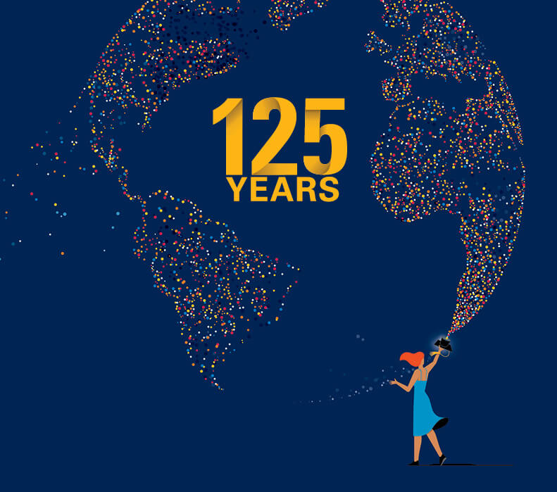 Illustration of Haas graduate filling the sky with a globe shaped light mosaic composed of colored dots. The dots are all exiting from the graduation cap. At the center is the 125 Year commemorative logo.