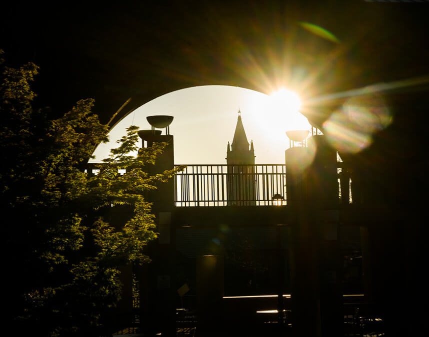 Image of Haas archway with Campanile in background as sun sets